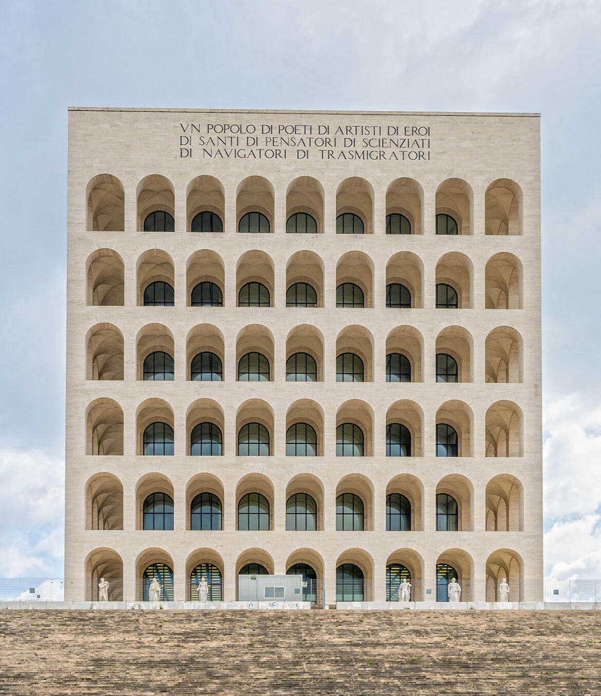 Italian Architectural Landmarks, Guide to Italian Advertising Garbatella district iconic building with 6 floors of repeated arched windows in limestone, from leading Italy market advertising media agency